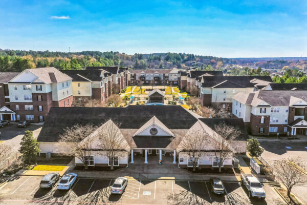 Aerial view of The Overlook leasing office and apartment courtyard with pool in Nacogdoches TX