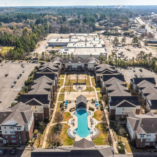 Aerial view of The Overlook student apartment community with resort-style pool in Nacogdoches TX