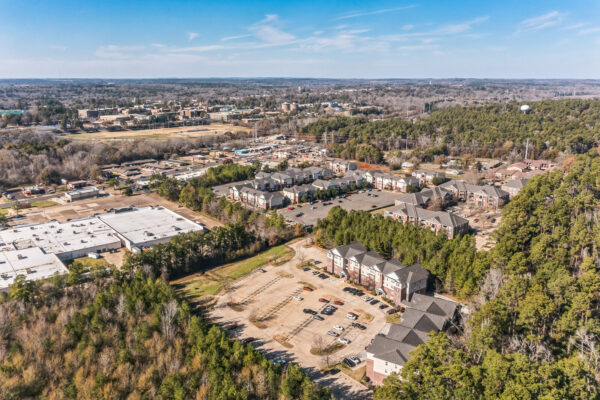 High aerial view of The Overlook student apartments with SFA campus visible in the distance Nacogdoches TX