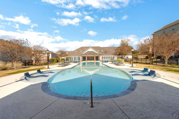 Resort-style pool with lounge chairs and no diving area at The Overlook student apartments Nacogdoches
