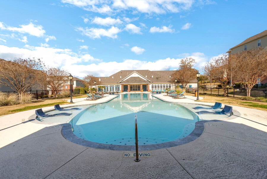 Resort-style pool with lounge chairs and no diving area at The Overlook student apartments Nacogdoches