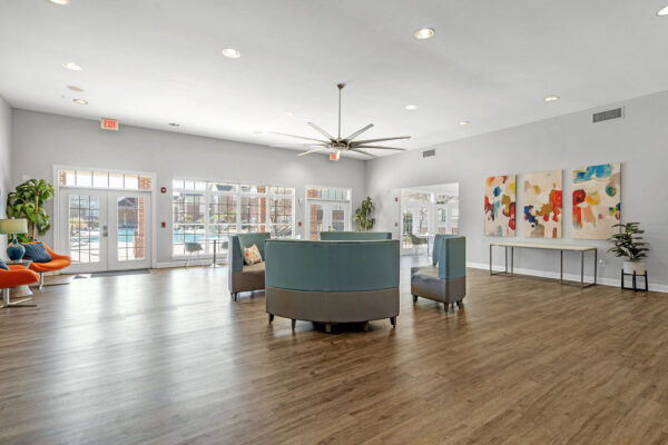 Spacious resident clubhouse lounge with pool views at The Overlook student apartments near SFA